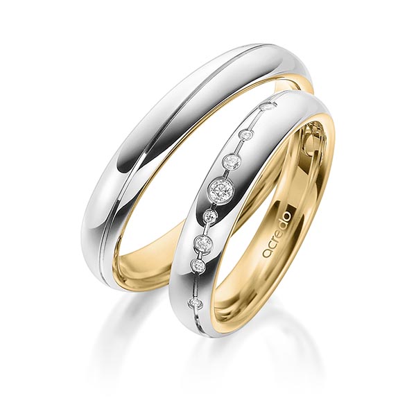 Set Bicolor trouwringen in buiten witgoud 14 kt. , binnen geelgoud 14 kt. met in totaal 0,08 ct. Briljant tw/si van acredo