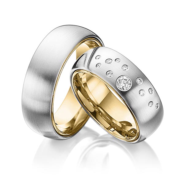 Set Bicolor trouwringen in buiten witgoud 14 kt. , binnen geelgoud 14 kt. met in totaal 0,235 ct. Briljant tw/si van Eternal Touch