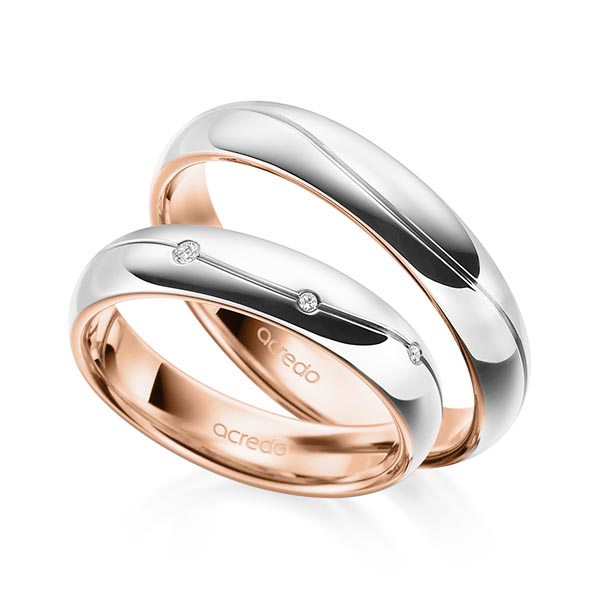 Set Bicolor trouwringen in buiten witgoud 14 kt. , binnen roodgoud 14 kt. met in totaal 0,06 ct. Briljant tw/si van acredo