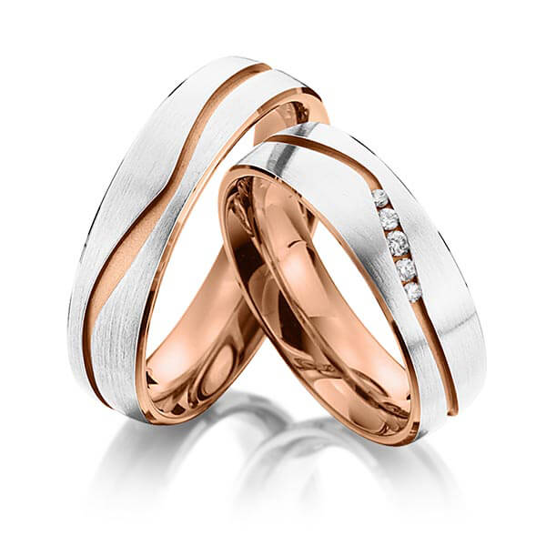 Set Bicolor trouwringen in buiten witgoud 14 kt. , binnen roodgoud 14 kt. met in totaal 0,07 ct. Briljant tw/si van Eternal Touch