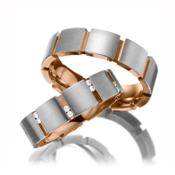 Set Bicolor trouwringen in buiten witgoud 14 kt. , binnen roodgoud 14 kt. met in totaal 0,2 ct. Briljant tw/si van Eternal Touch