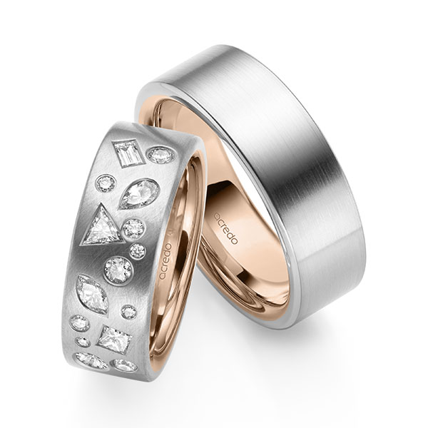 Set Bicolor trouwringen in buiten witgoud 14 kt. , binnen roodgoud 14 kt. met in totaal 0,9 ct. Princess-Diamant & Baguette-Diamant & Briljant tw/si tw,vs van acredo