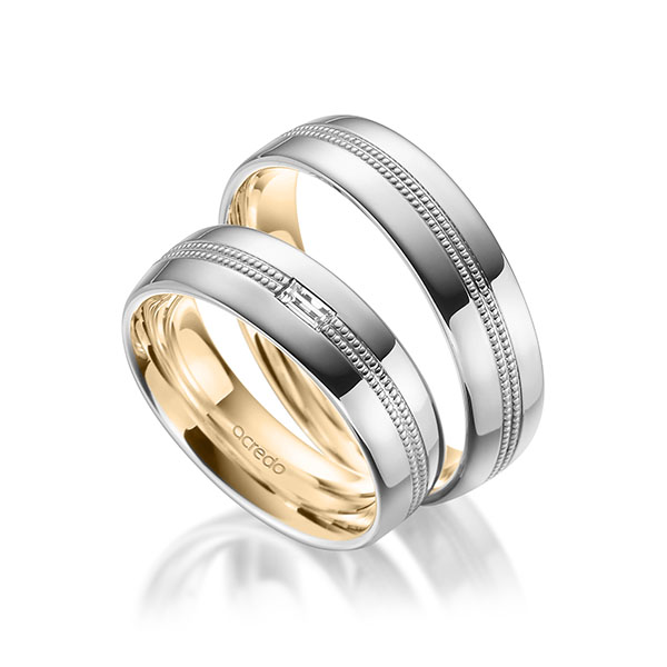 Set Bicolor trouwringen in buiten witgoud 14 kt. , binnen roségoud 14 kt. met in totaal 0,1 ct. Baguette-Diamant tw,vs van acredo