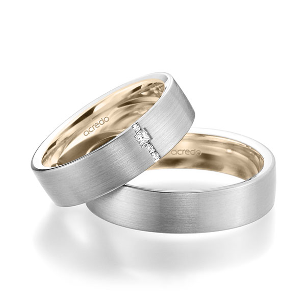 Set Bicolor trouwringen in buiten witgoud 14 kt. , binnen Signature Goud 585 met in totaal 0,045 ct. Briljant & Princess-Diamant tw/si van acredo