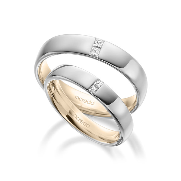 Set Bicolor trouwringen in buiten witgoud 14 kt. , binnen Signature Goud 585 met in totaal 0,18 ct. Princess-Diamant tw/si van acredo