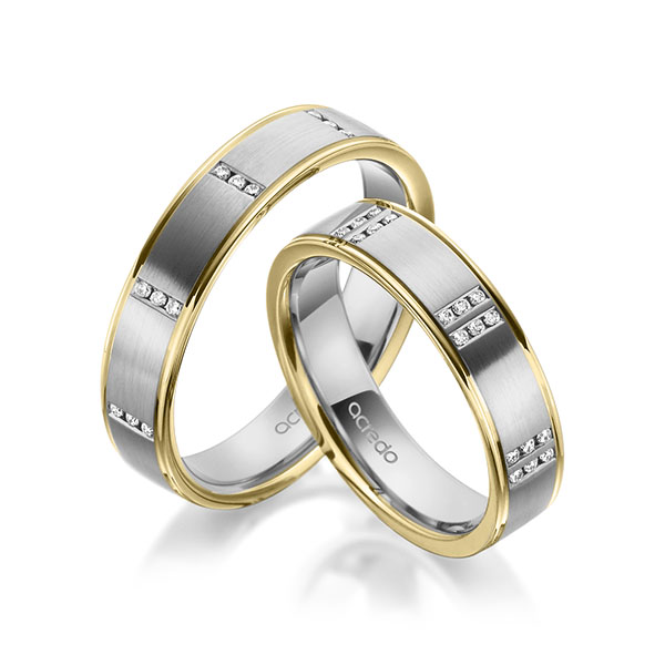 Set Bicolor trouwringen in geelgoud 14 kt. grijsgoud 14 kt. met in totaal 0,345 ct. Briljant tw,vs van acredo