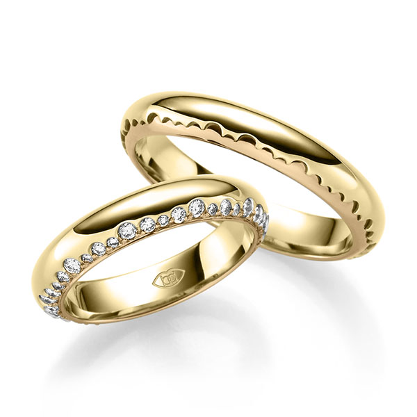 Set Bicolor trouwringen in geelgoud 14 kt. roségoud 14 kt. met in totaal 0,6 ct. Briljant tw/si 