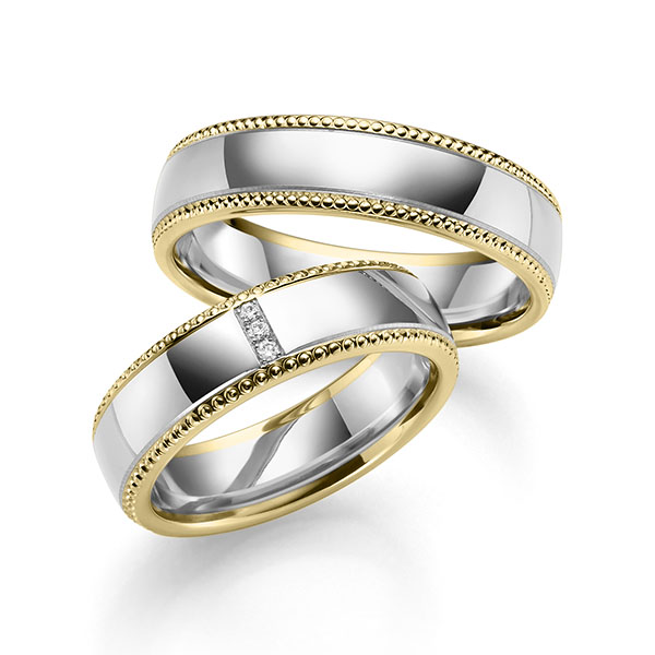 Set Bicolor trouwringen in geelgoud 14 kt. witgoud 14 kt. met in totaal 0,015 ct. Briljant tw/si van Eternal Touch