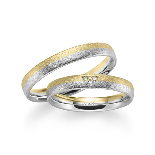 Set Bicolor trouwringen in geelgoud 14 kt. witgoud 14 kt. met in totaal 0,024 ct. Briljant tw/si van acredo