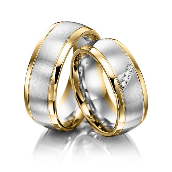 Set Bicolor trouwringen in geelgoud 14 kt. witgoud 14 kt. met in totaal 0,04 ct. Briljant tw,vs van acredo