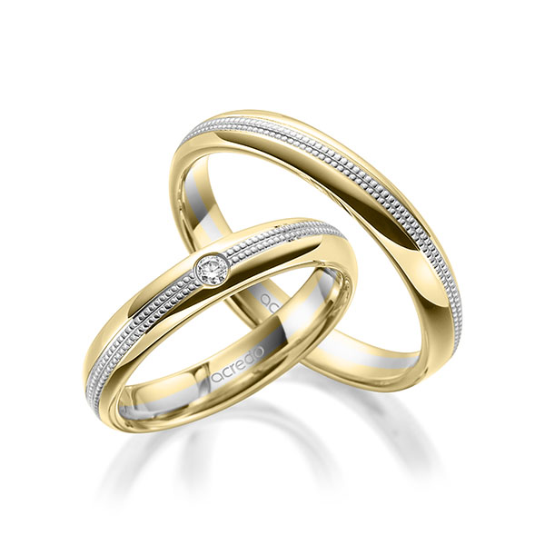 Set Bicolor trouwringen in geelgoud 14 kt. witgoud 14 kt. met in totaal 0,05 ct. Briljant tw/si van acredo Set Bicolor trouwringen in geelgoud 14 kt. witgoud 14 kt. met in totaal 0,05 ct. Briljant tw/si van acredo
