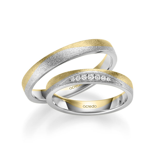 Set Bicolor trouwringen in geelgoud 14 kt. witgoud 14 kt. met in totaal 0,061 ct. Briljant tw/si van acredo