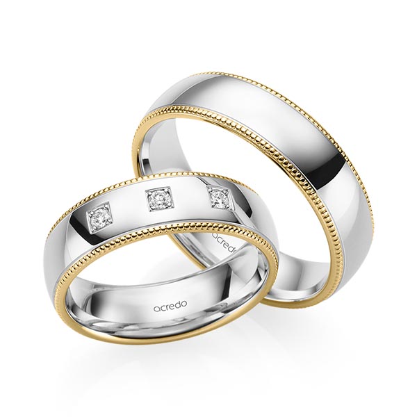 Set Bicolor trouwringen in geelgoud 14 kt. witgoud 14 kt. met in totaal 0,09 ct. Briljant tw/si van acredo
