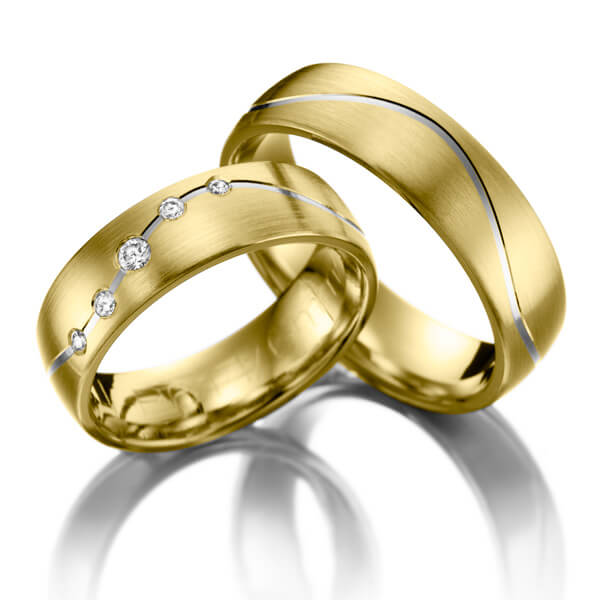 Set Bicolor trouwringen in geelgoud 14 kt. witgoud 14 kt. met in totaal 0,1 ct. Briljant tw/si 
