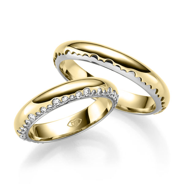 Set Bicolor trouwringen in geelgoud 14 kt. witgoud 14 kt. met in totaal 0,6 ct. Briljant tw/si 