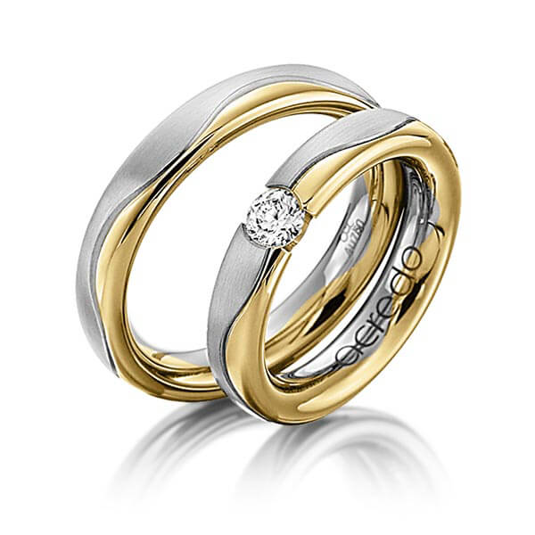 Set Bicolor trouwringen in grijsgoud 14 kt. geelgoud 14 kt. met 0,3 ct. Briljant tw/si van acredo