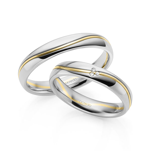 Set Bicolor trouwringen in grijsgoud 14 kt. geelgoud 14 kt. met in totaal 0,015 ct. Briljant tw/si van acredo