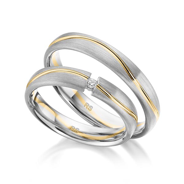 Set Bicolor trouwringen in grijsgoud 14 kt. geelgoud 14 kt. met in totaal 0,03 ct. Briljant tw/si van acredo