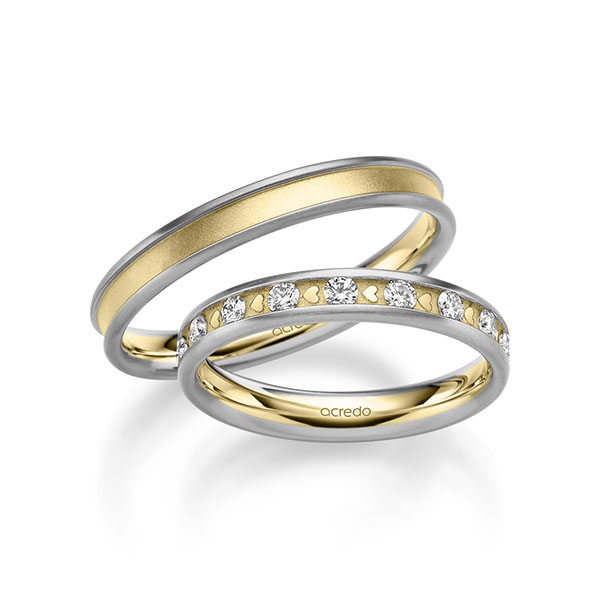 Set Bicolor trouwringen in grijsgoud 14 kt. geelgoud 14 kt. met in totaal 0,68 ct. Briljant tw/si van acredo