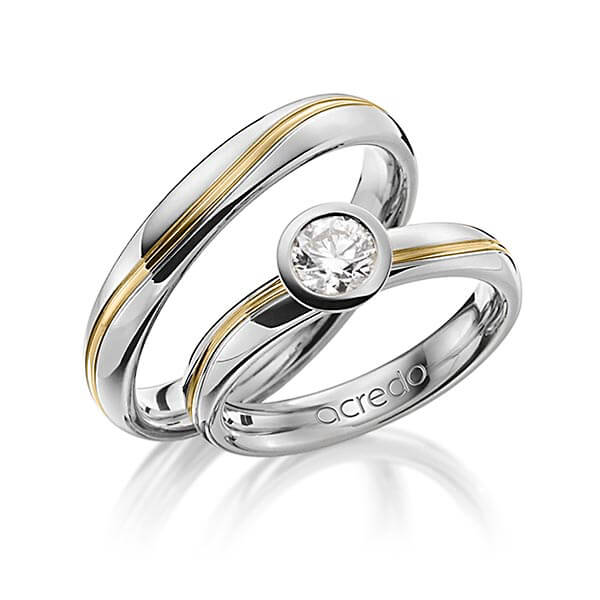Set Bicolor trouwringen in grijsgoud 18 kt. geelgoud 18 kt. met 0,5 ct. Briljanten r,if van acredo - A-1256-7 Set Bicolor trouwringen in grijsgoud 18 kt. geelgoud 18 kt. met 0,5 ct. Briljanten r,if van acredo - A-1256-7