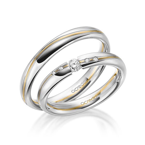 Set Bicolor trouwringen in grijsgoud 18 kt. geelgoud 916 met in totaal 0,07 ct. Briljant tw/si van acredo