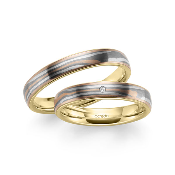 Set Bicolor trouwringen in Mokume Gane roodgoud 14 kt., zilver 925, palladium 500 Basis-Ring geelgoud 14 kt. met in totaal 0,01 ct. Briljant tw,vs van acredo