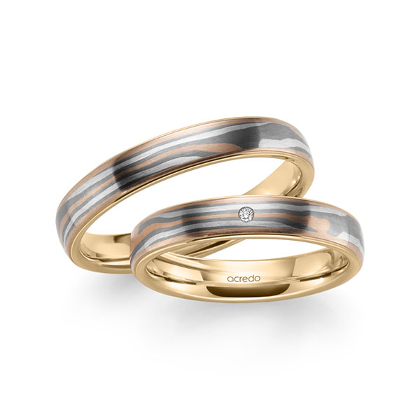 Set Bicolor trouwringen in Mokume Gane roodgoud 14 kt., zilver 925, palladium 500 Basis-Ring roségoud 14 kt. met in totaal 0,01 ct. Briljant tw,vs van acredo