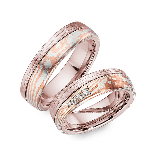 Set Bicolor trouwringen in roodgoud 14 kt. Mokume Gane silver 925 copper met in totaal 0,053 ct. Briljant tw/si 