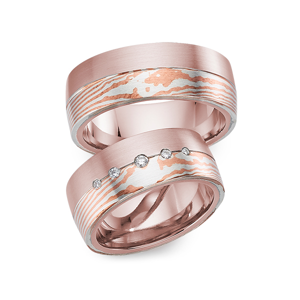 Set Bicolor trouwringen in roodgoud 14 kt. Mokume Gane silver 925 copper met in totaal 0,09 ct. Briljant tw/si 
