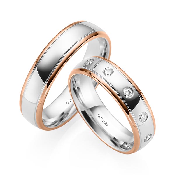 Set Bicolor trouwringen in roodgoud 14 kt. witgoud 14 kt. met in totaal 0,15 ct. Briljant tw/si van acredo
