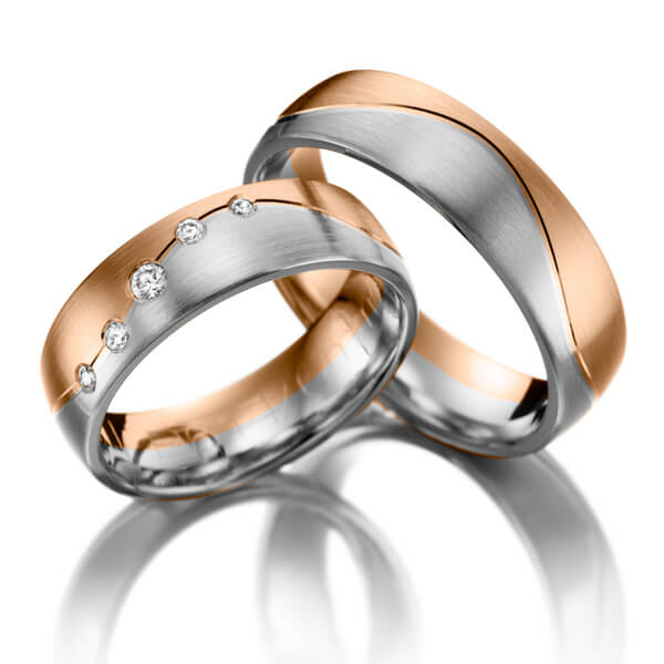 Set Bicolor trouwringen in roodgoud 14 kt. witgoud 14 kt. met in totaal 0,1 ct. Briljant tw/si 