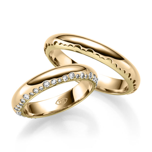 Set Bicolor trouwringen in roségoud 14 kt. geelgoud 14 kt. met in totaal 0,6 ct. Briljant tw/si 