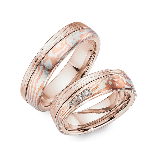 Set Bicolor trouwringen in roségoud 14 kt. Mokume Gane silver 925 copper met in totaal 0,053 ct. Briljant tw/si 
