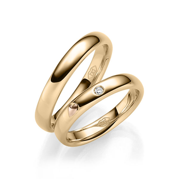 Set Bicolor trouwringen in roségoud 14 kt. roodgoud 14 kt. met in totaal 0,03 ct. Briljant tw/si 