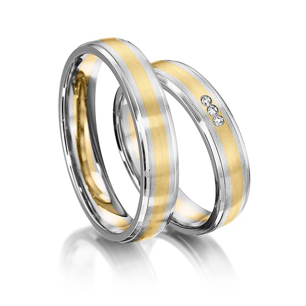 Set Bicolor trouwringen in witgoud 14 kt. geelgoud 14 kt. met in totaal 0,024 ct. Briljant tw/si van acredo