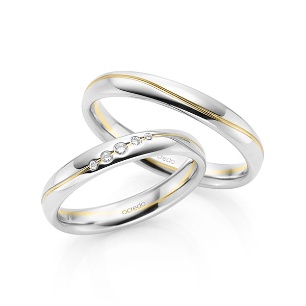 Set Bicolor trouwringen in witgoud 14 kt. geelgoud 14 kt. met in totaal 0,041 ct. Briljant tw/si van acredo