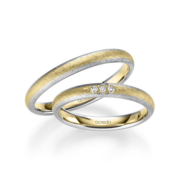 Set Bicolor trouwringen in witgoud 14 kt. geelgoud 14 kt. met in totaal 0,045 ct. Briljant tw/si van acredo