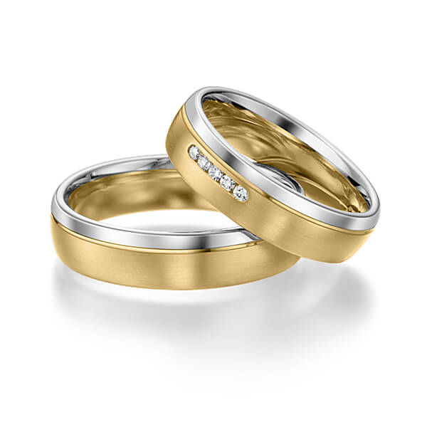 Set Bicolor trouwringen in witgoud 14 kt. geelgoud 14 kt. met in totaal 0,05 ct. Briljant tw/si van acredo
