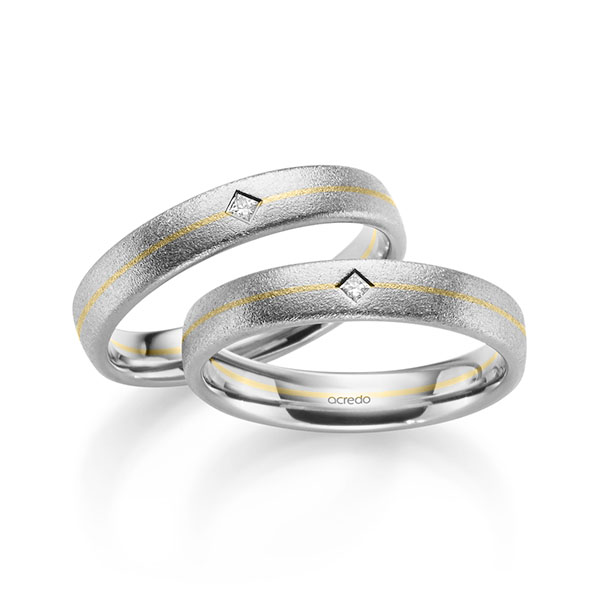 Set Bicolor trouwringen in witgoud 14 kt. geelgoud 14 kt. met in totaal 0,05 ct. Princess-Diamant tw/si van acredo