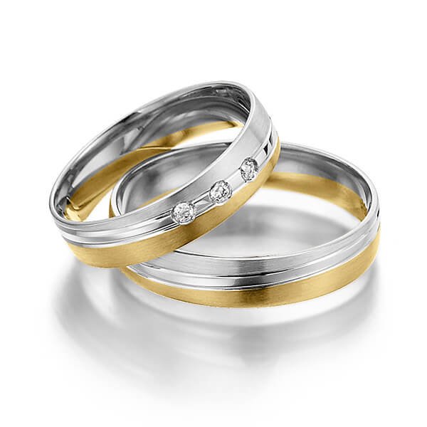 Set Bicolor trouwringen in witgoud 14 kt. geelgoud 14 kt. met in totaal 0,06 ct. Briljant tw/si van Steinberg
