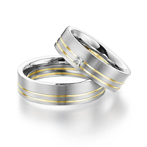 Set Bicolor trouwringen in witgoud 14 kt. geelgoud 14 kt. met in totaal 0,06 ct. Princess-Diamant tw/si van Steinberg