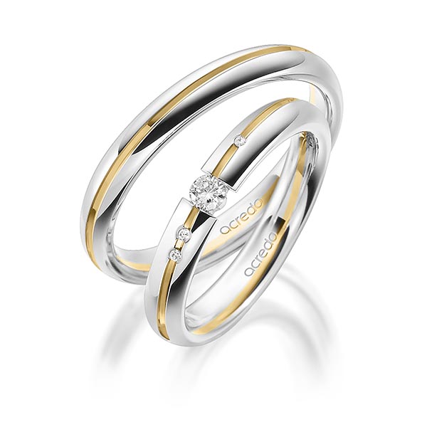 Set Bicolor trouwringen in witgoud 14 kt. geelgoud 14 kt. met in totaal 0,115 ct. Briljant tw/si van acredo