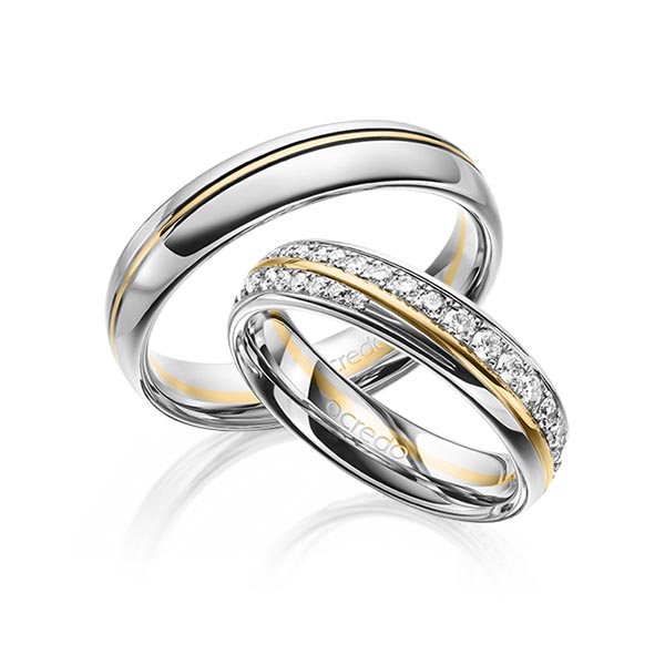 Set Bicolor trouwringen in witgoud 14 kt. geelgoud 14 kt. met in totaal 0,964 ct. Briljant tw/si van acredo