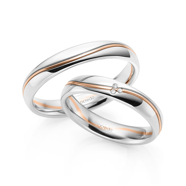 Set Bicolor trouwringen in witgoud 14 kt. roodgoud 14 kt. met in totaal 0,015 ct. Briljant tw/si van acredo