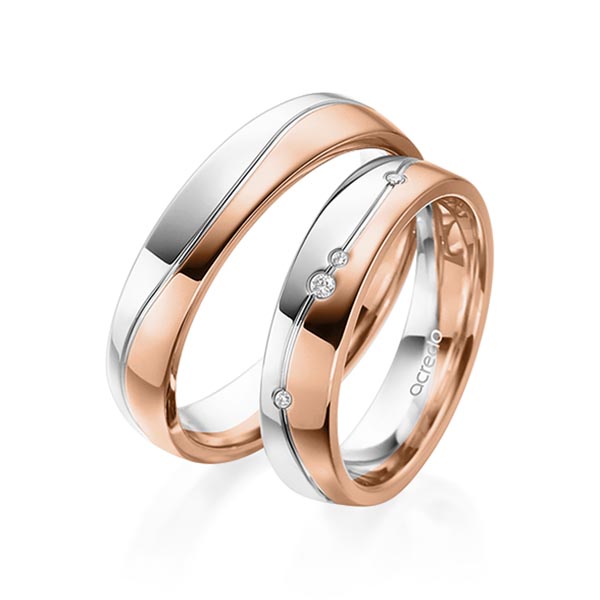 Set Bicolor trouwringen in witgoud 14 kt. roodgoud 14 kt. met in totaal 0,036 ct. Briljant tw/si van acredo