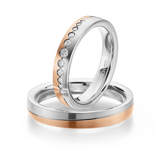 Set Bicolor trouwringen in witgoud 14 kt. roodgoud 14 kt. met in totaal 0,156 ct. Briljant tw/si van acredo