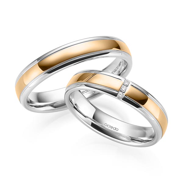 Set Bicolor trouwringen in witgoud 14 kt. roségoud 14 kt. met in totaal 0,03 ct. Briljant tw/si van acredo