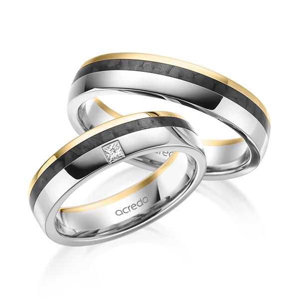 Set Carbon trouwringen in geelgoud 14 kt. grijsgoud 14 kt. met in totaal 0,05 ct. Princess-Diamant tw/si van acredo
