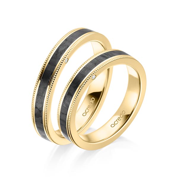 Set Carbon trouwringen in geelgoud 14 kt. met in totaal 0,01 ct. Briljant tw/si van acredo