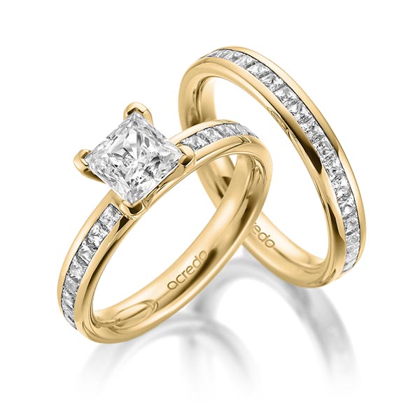 Set in geelgoud 14 kt. met 1 ct. + in totaal 1,05 ct. Briljant & Princess-Diamant tw,vs tw/si van acredo - A-2004-2 Set in geelgoud 14 kt. met 1 ct. + in totaal 1,05 ct. Briljant & Princess-Diamant tw,vs tw/si van acredo - A-2004-2
